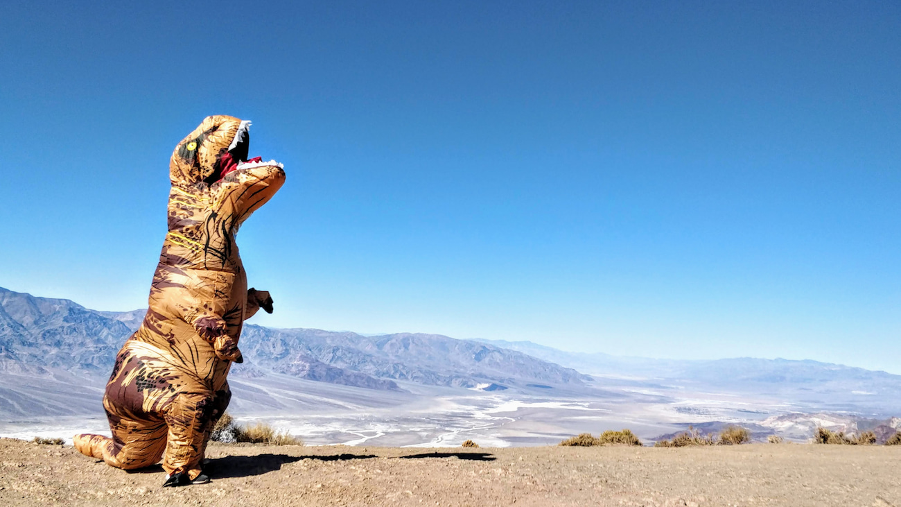 Henry Lim in a T-Rex costume at Death Valley National Park, California.